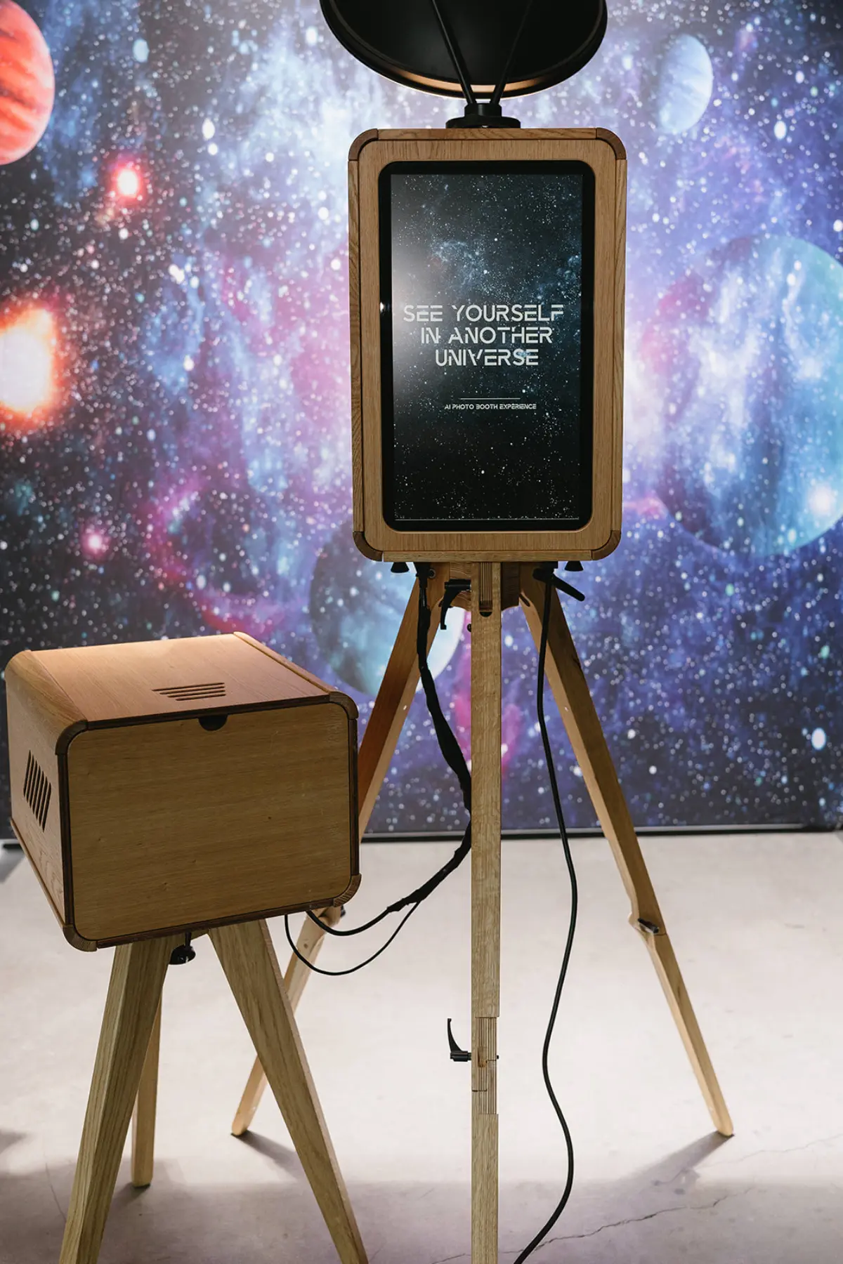 The Oak Booth wood photo booth set against a galaxy backdrop at a Los Angeles event with a custom on-screen design, Captured Celebrations