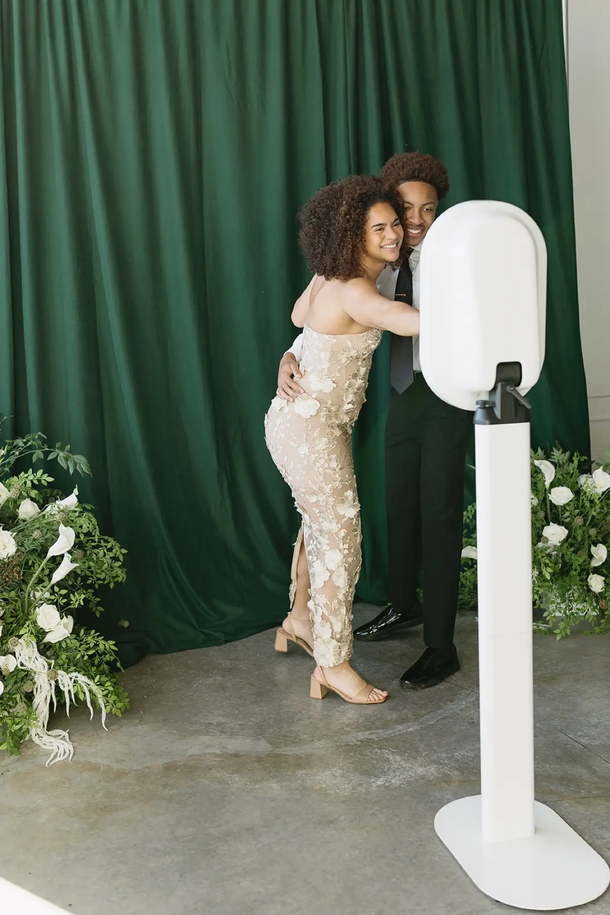 Velour floral backdrop open air photo booth at Los Angeles event