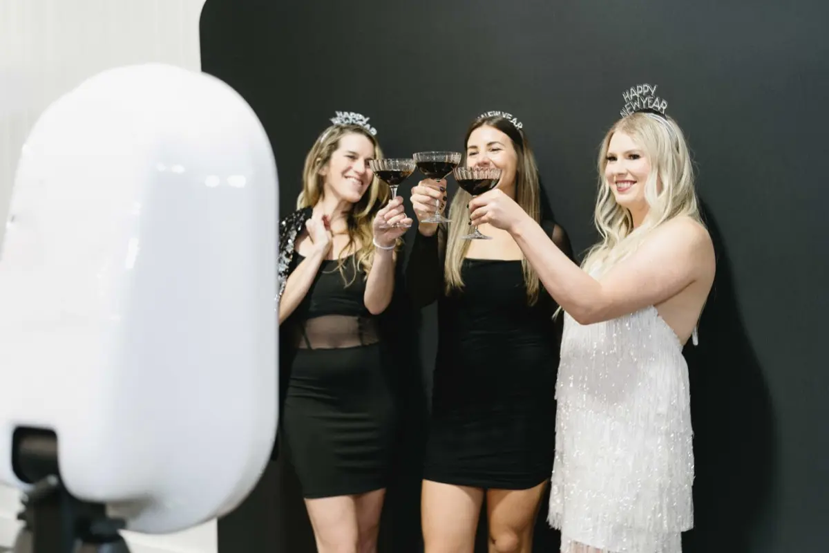 Spotlight photo booth with festive decorations at teen celebration