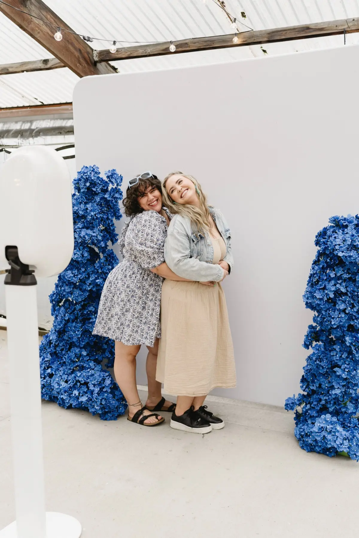 Couple posing at open air wedding photo booth in Los Angeles