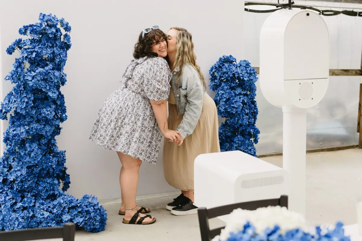 Wedding photo booth with elegant blue backdrop in Los Angeles